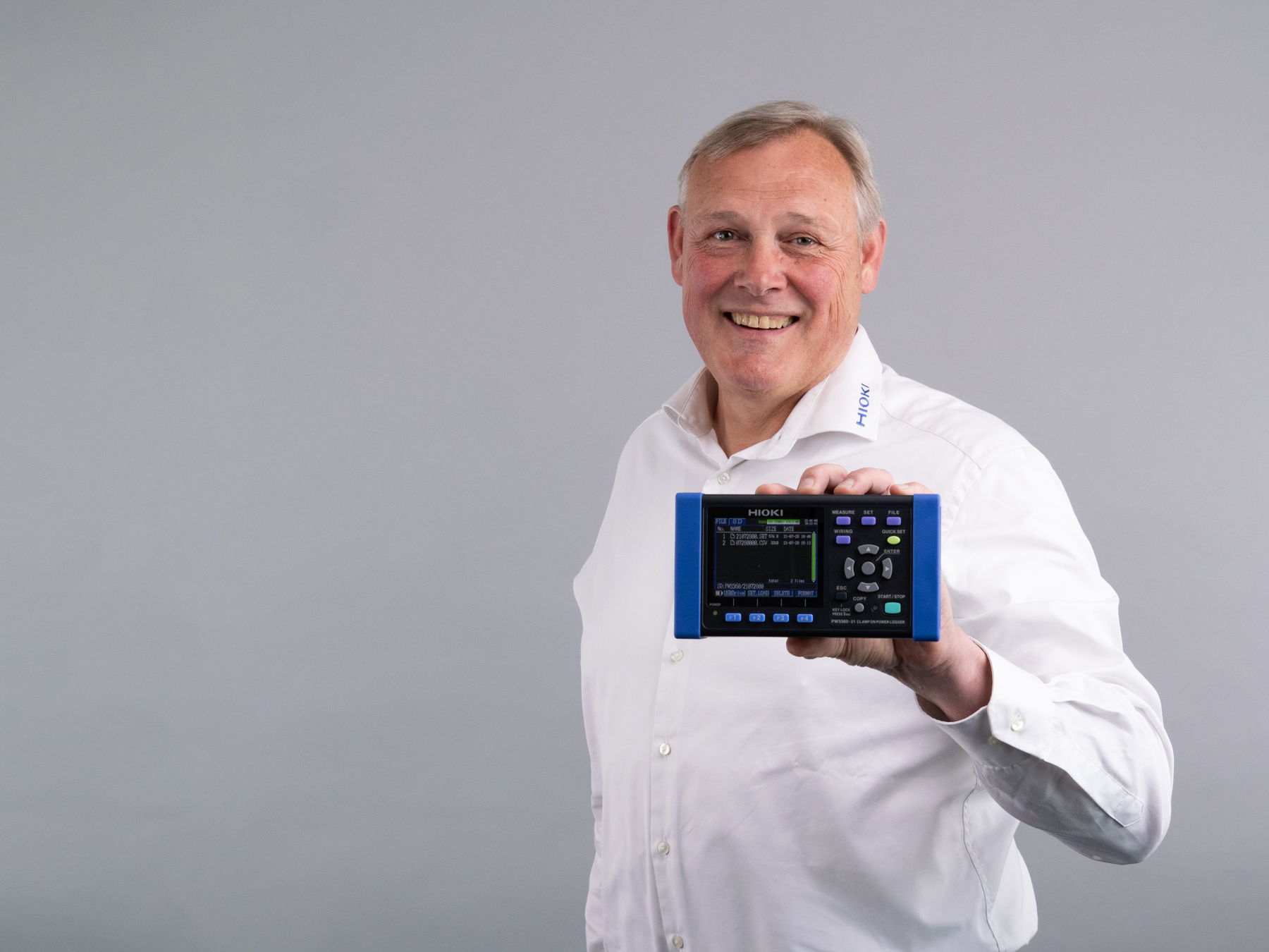 HIOKI PW3360-21 clamp on power logger 3phase 4wire white male holding