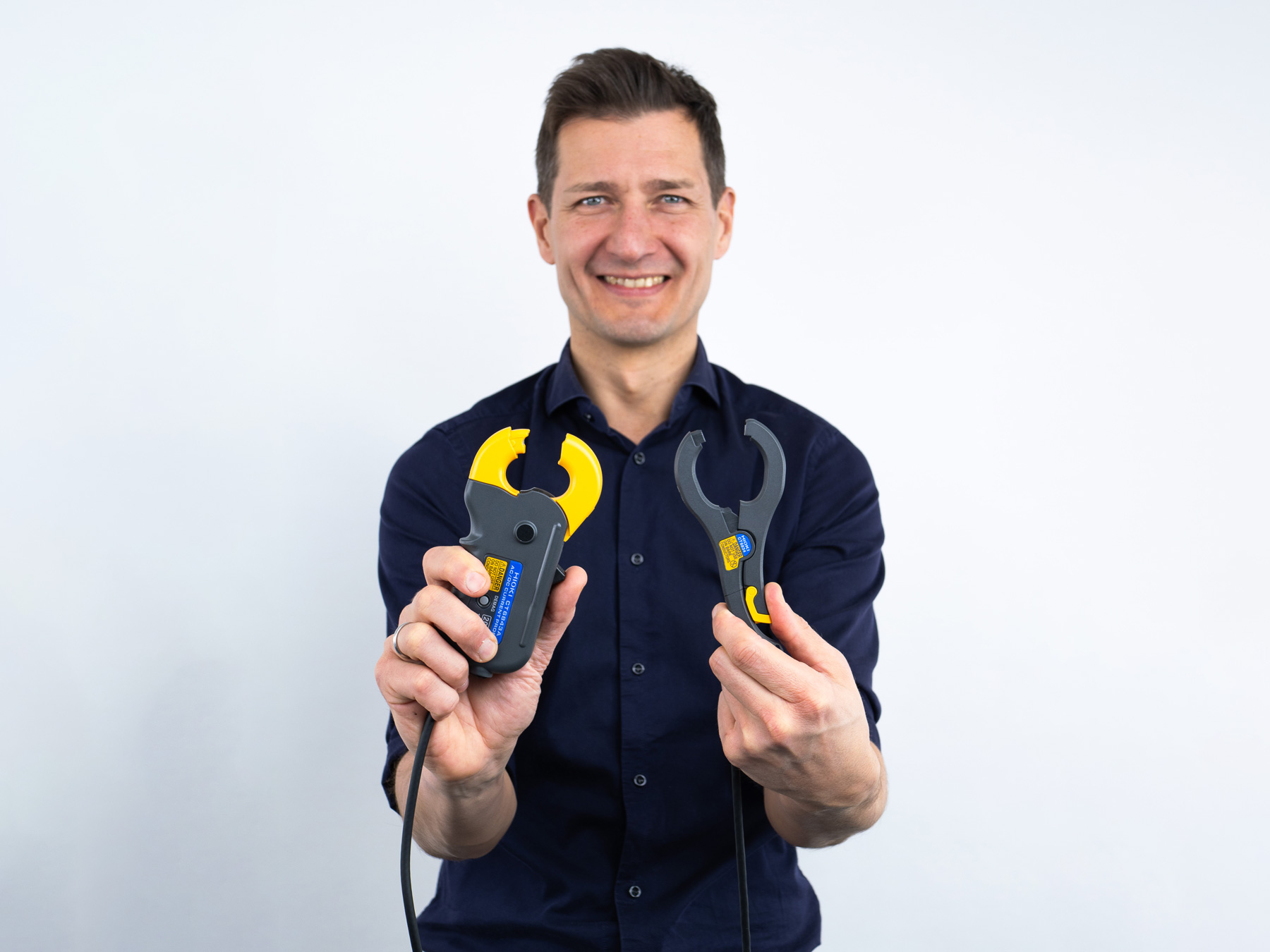 HIOKI CT6843A AC DC high accuracy current clamp man holding clamps